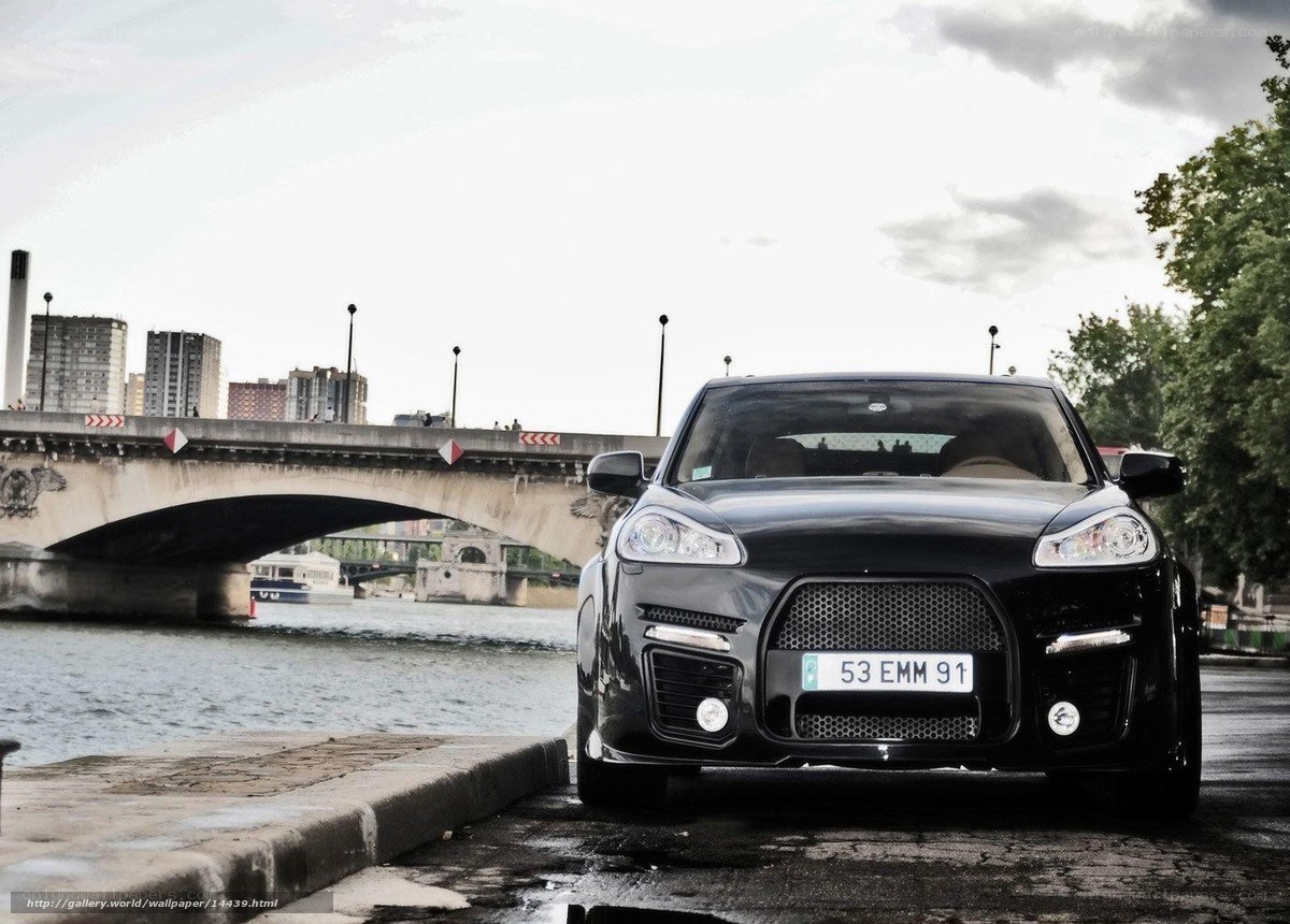 Black car on riverbank