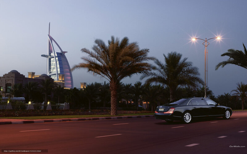 Black car on road at dusk