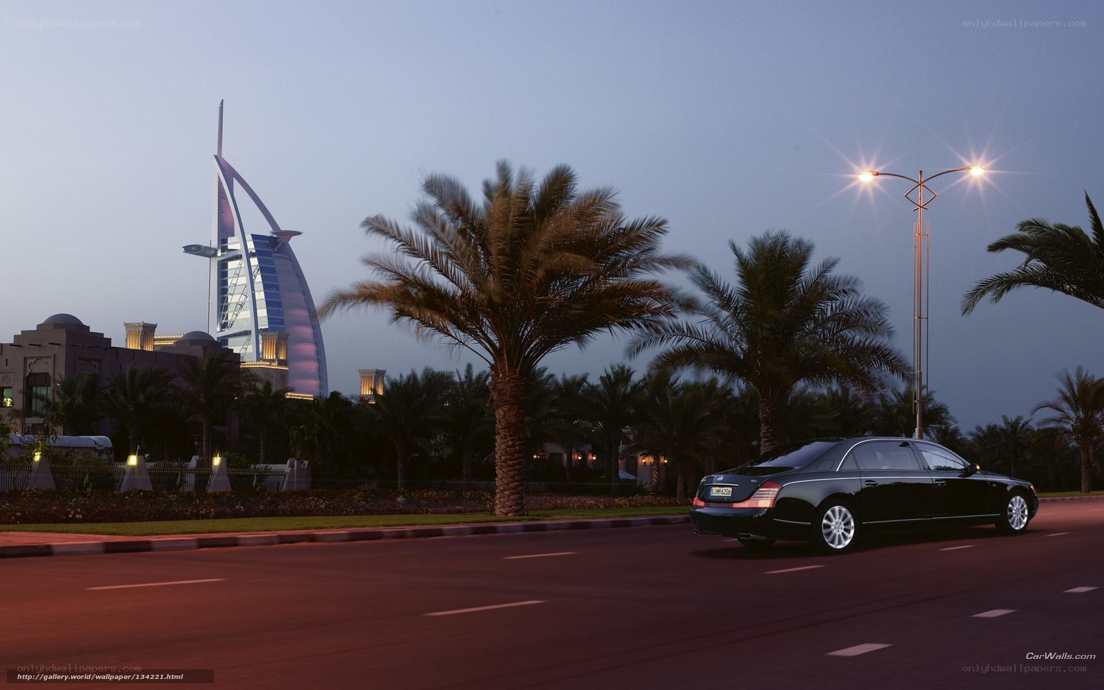 Black car on road at dusk