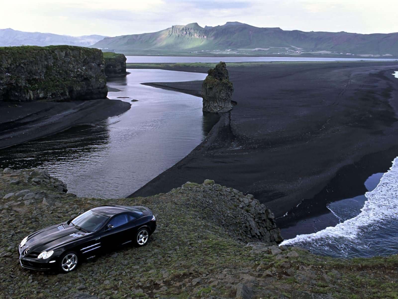 Black car on rocky cliff