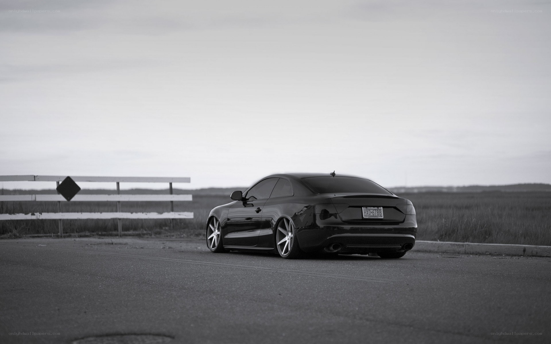 black car on rural road