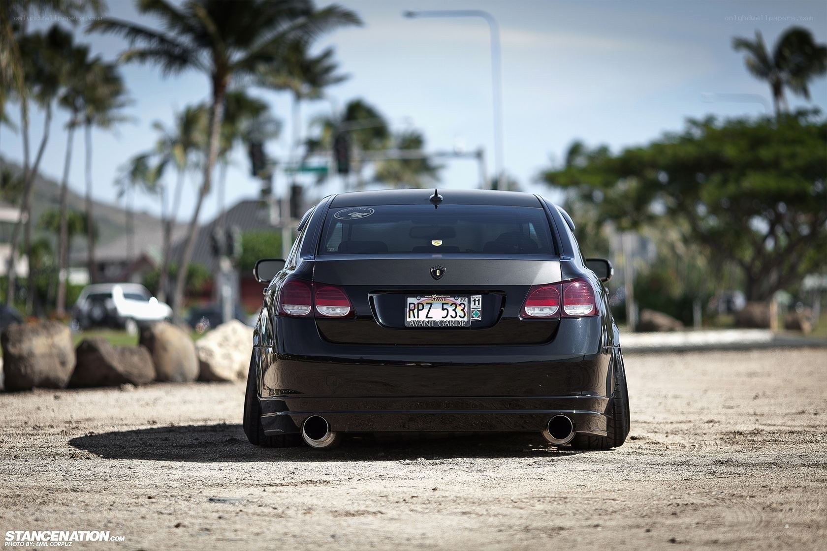 black car on sandy beach