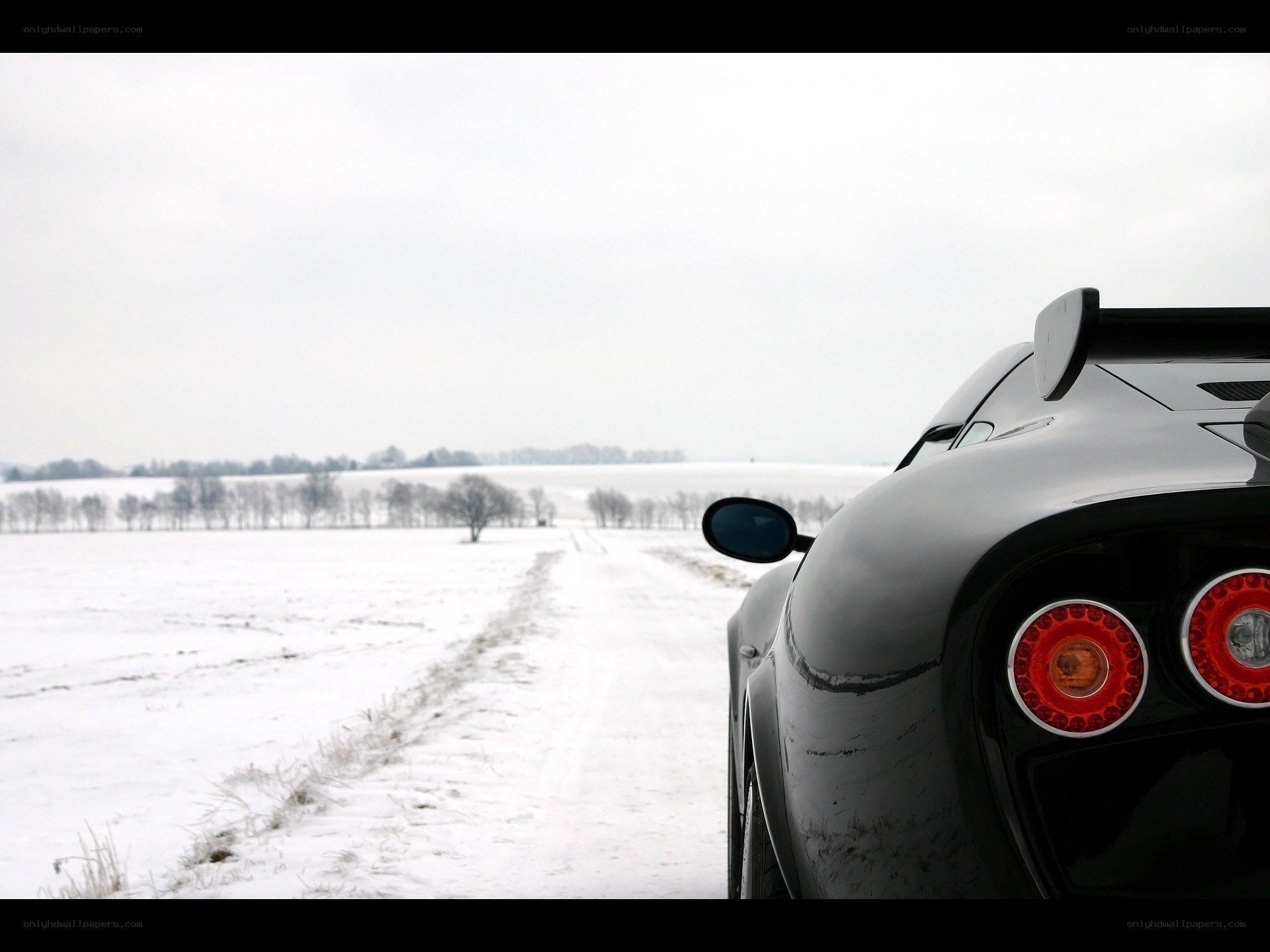 Black car on snowy road