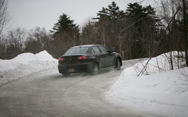 black car on snowy road