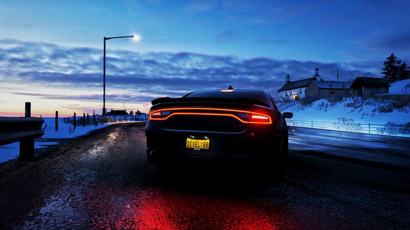 Black Car on Snowy Road — Blue