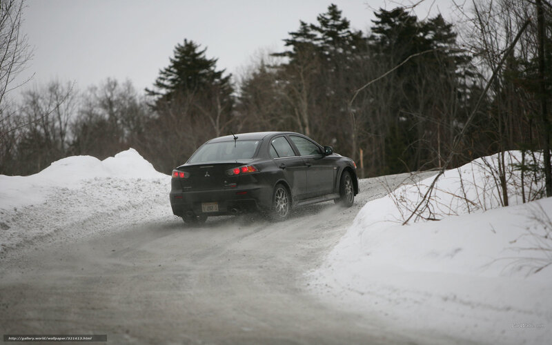black car on snowy road
