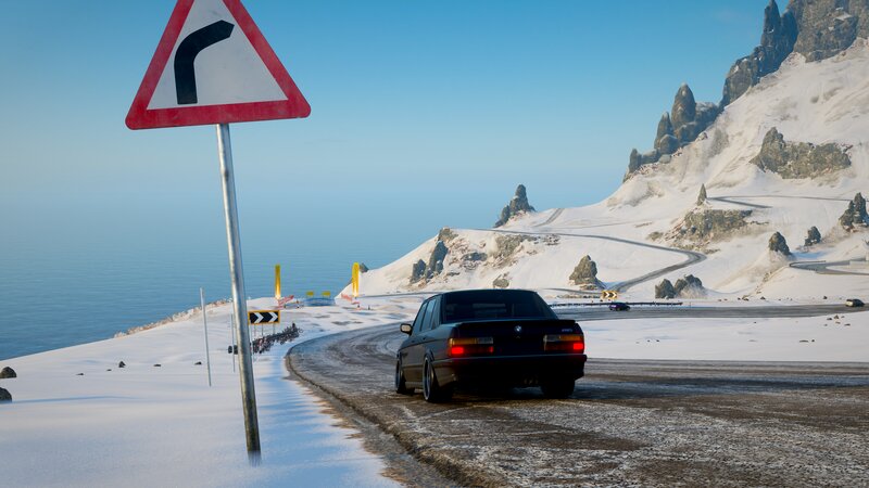 Black Car on Snowy Road — White