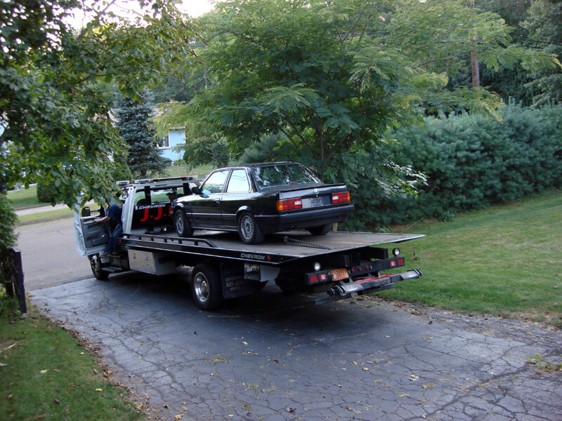 Black Car on Tow Truck
