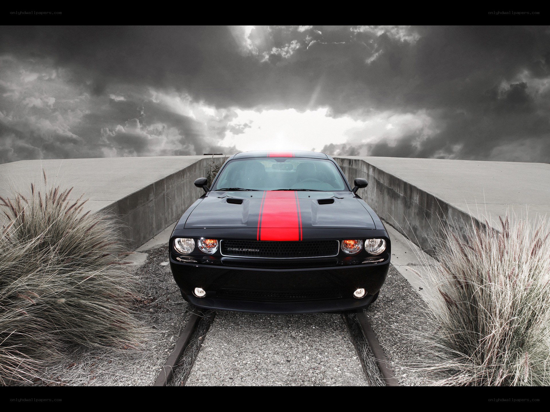 Black car on train tracks
