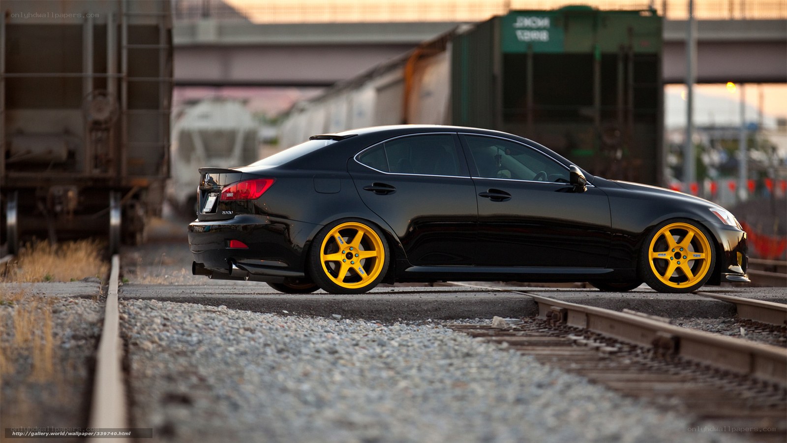 black car on train tracks