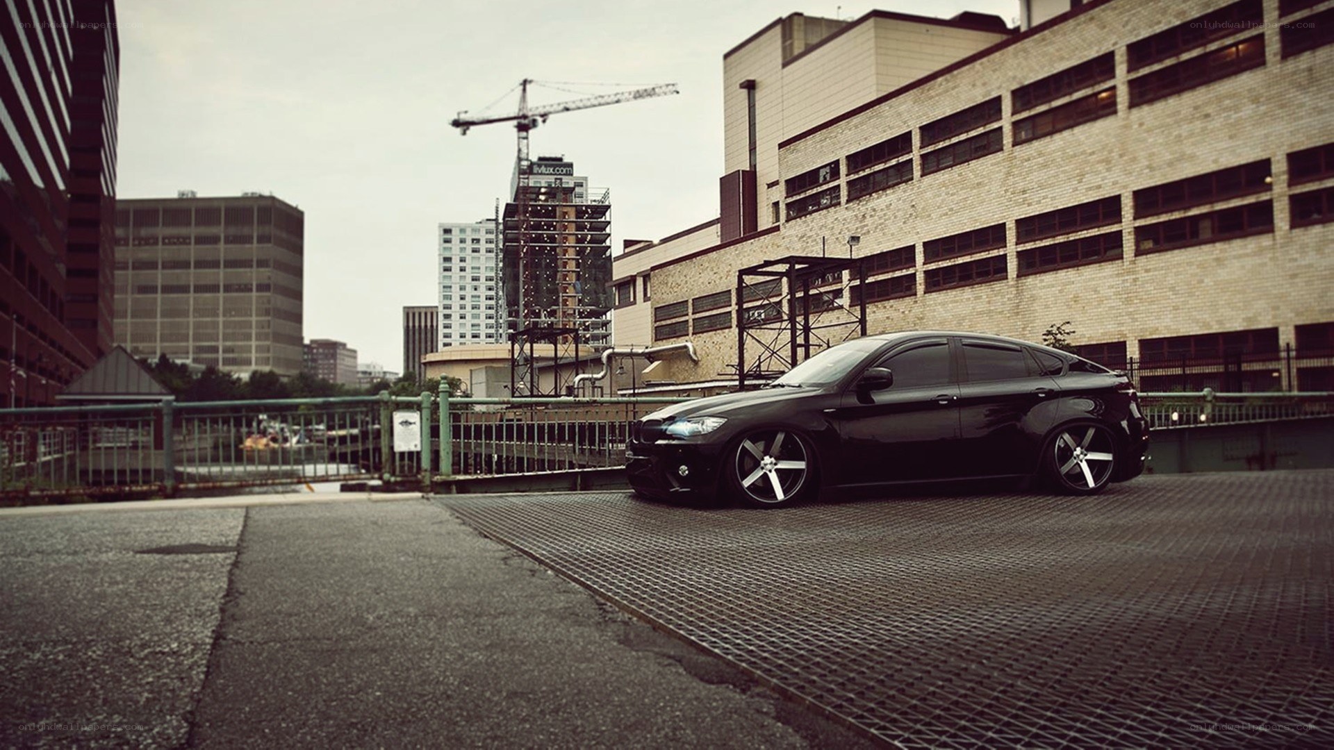 Black car on urban bridge