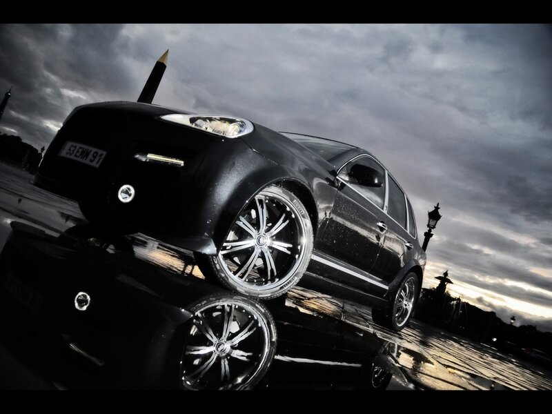 Black car on wet pavement