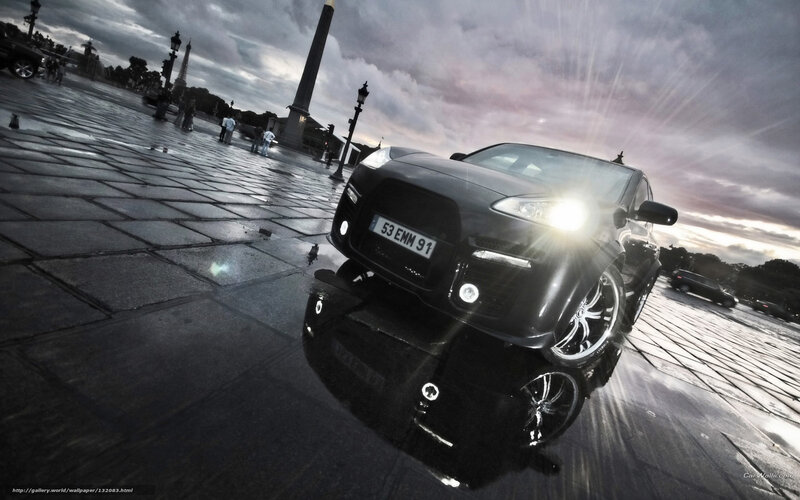Black Car on Wet Pavement — Dramatic
