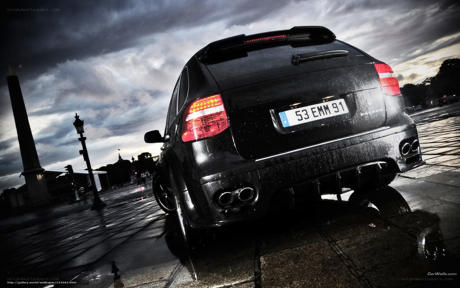 black car on wet pavement