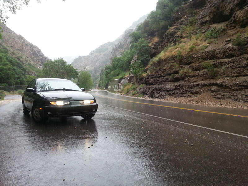 Black Car on Wet Road — Rainy