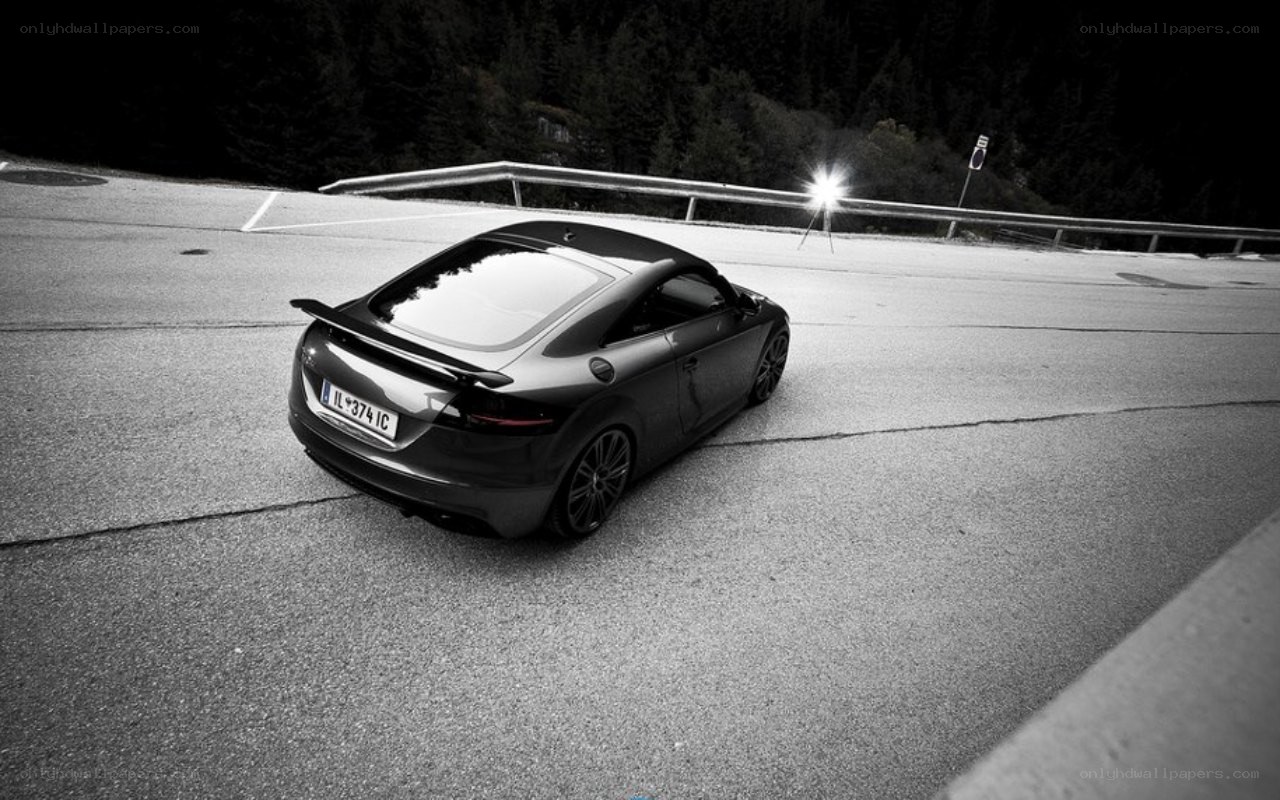 black car on winding road