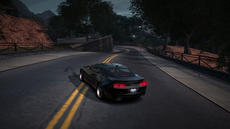 black car on winding road