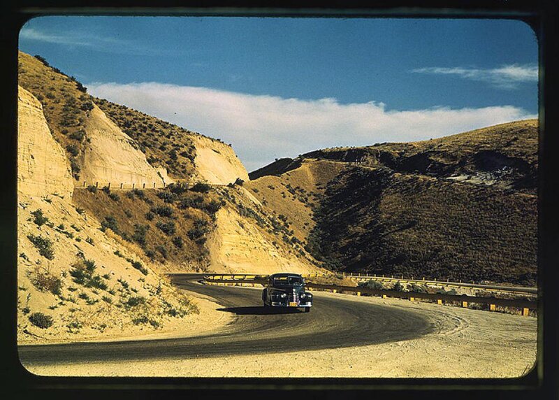 Black Car on Winding Road — Blue