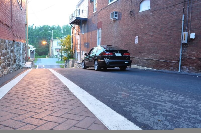 Black car parked in alley