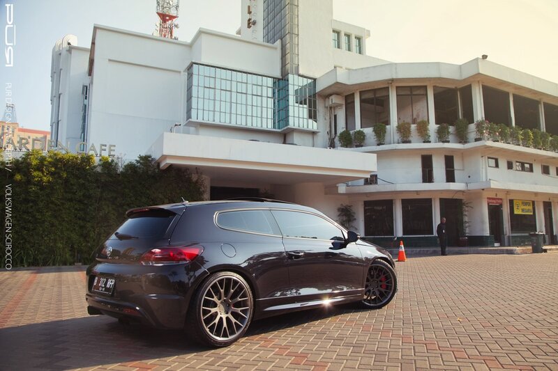 Black car parked in front of building