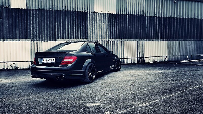 black car parked in industrial area