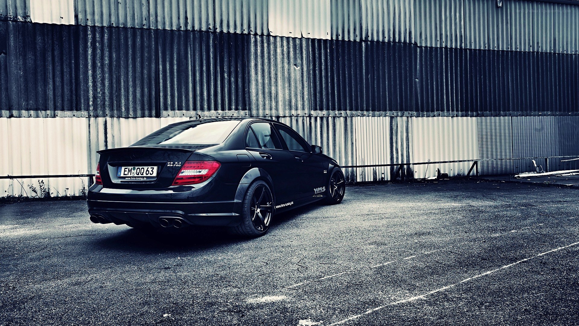 black car parked in industrial area