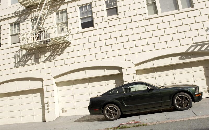 Black car parked on a hill