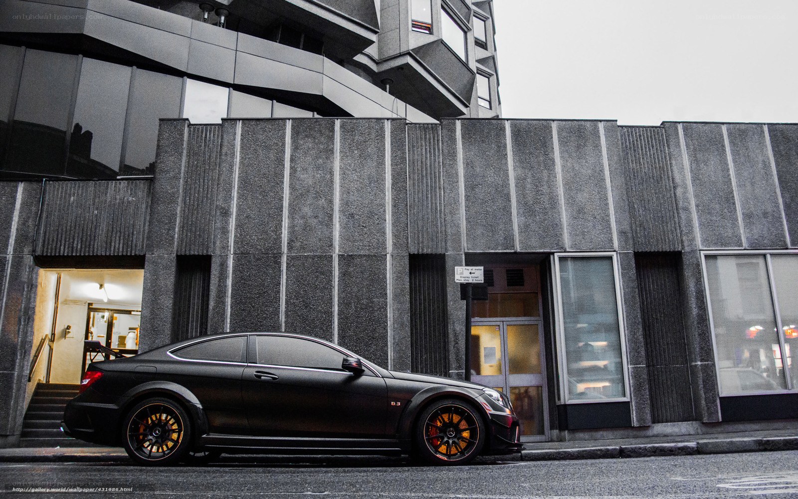 Black car parked on city street