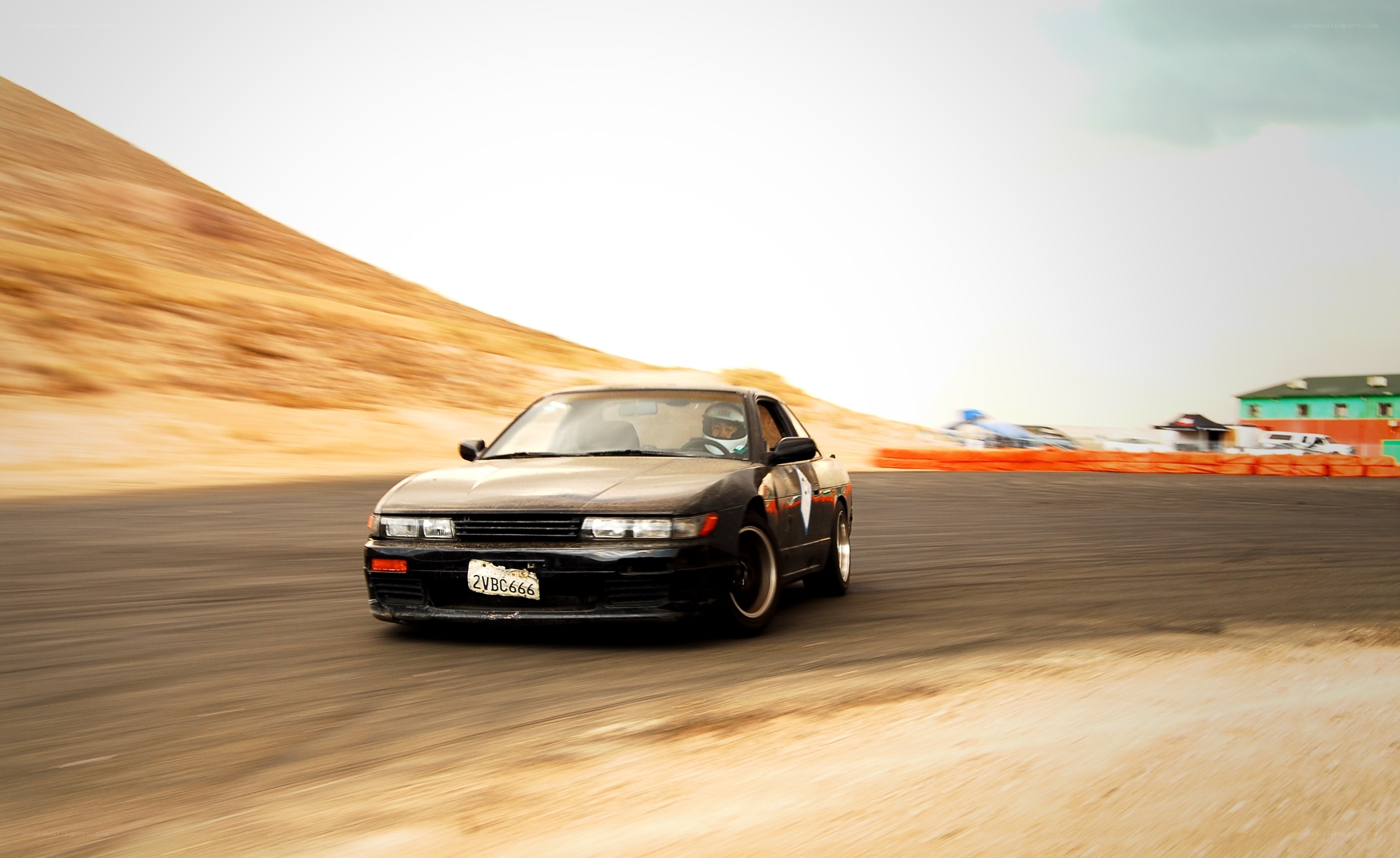 Black car racing on track