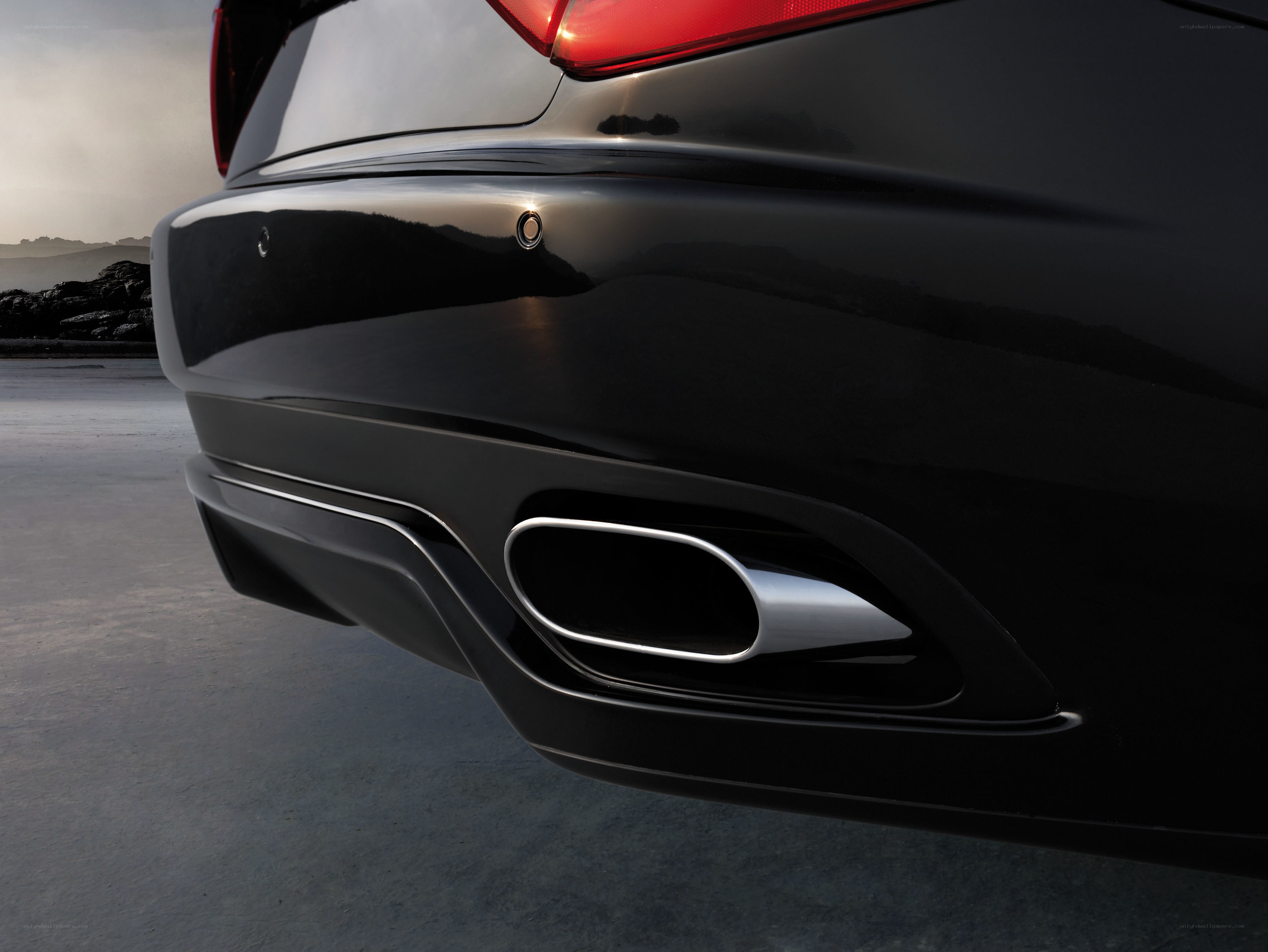 black car rear exhaust