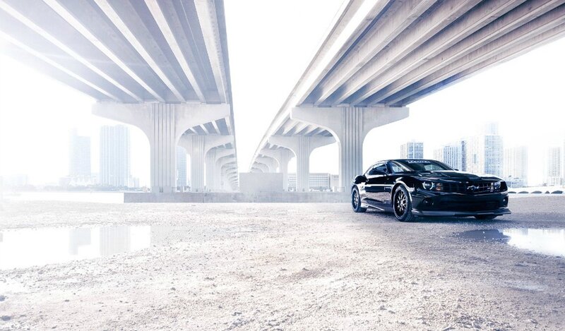 Black car under a bridge