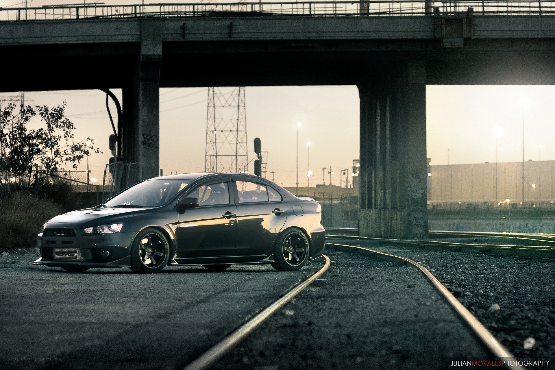 Black car under a bridge