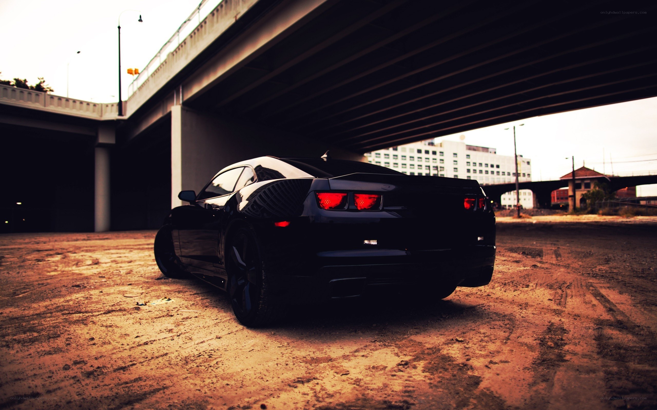 Black car under a bridge