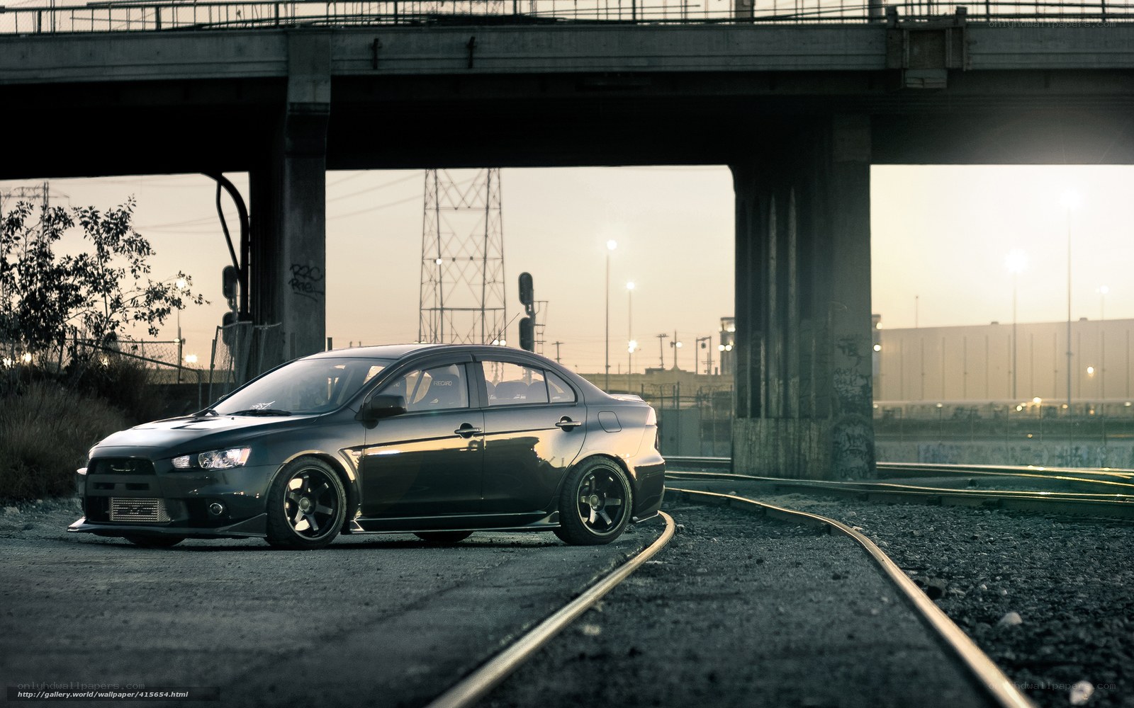Black car under a bridge