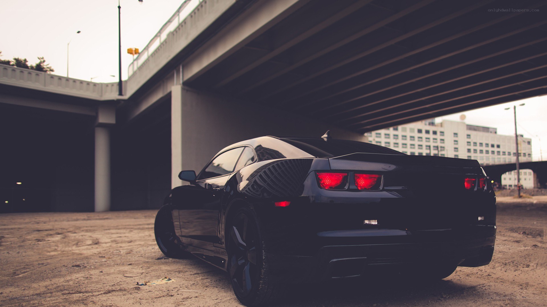 Black car under an overpass