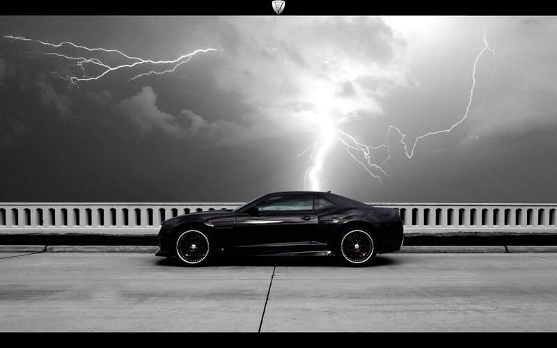 Black car under lightning storm