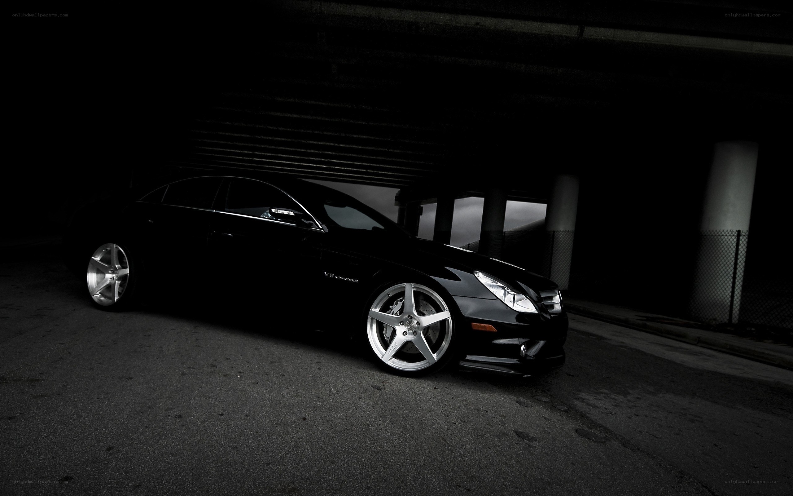 black car under overpass