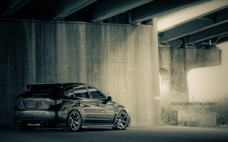 black car under overpass