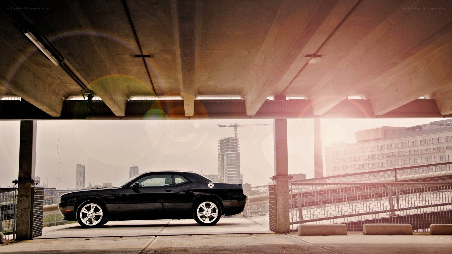 Black car under overpass