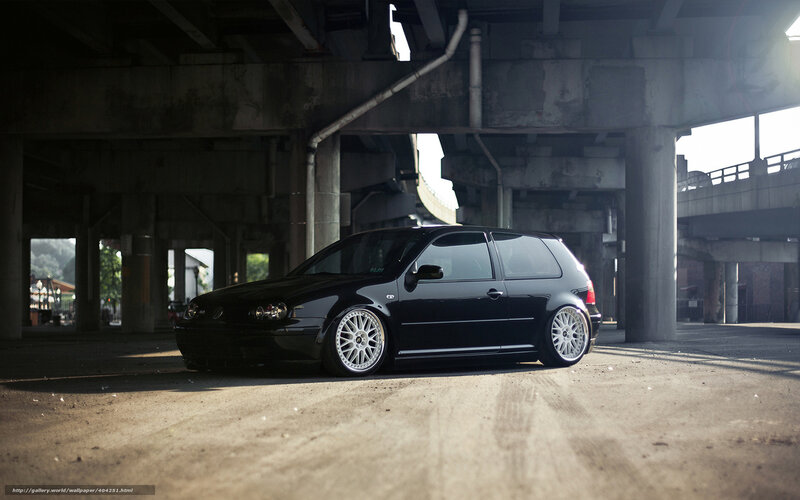 Black car under overpass