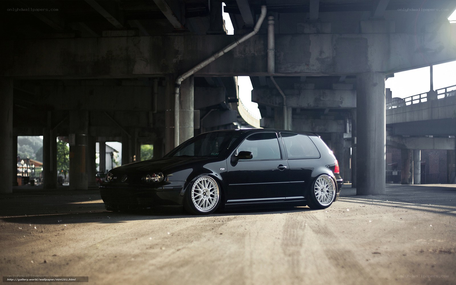 Black car under overpass