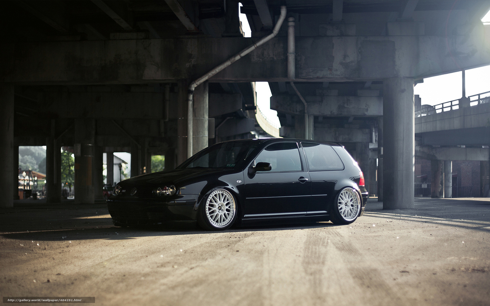 Black car under overpass