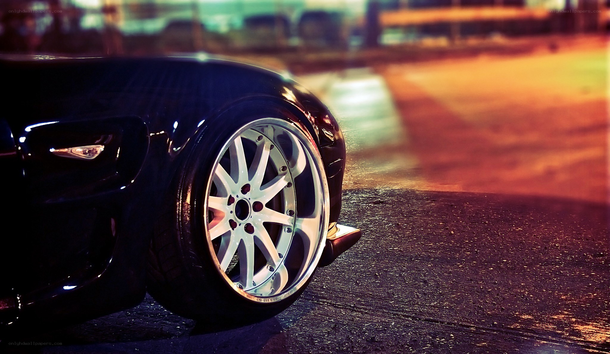 black car wheel at night