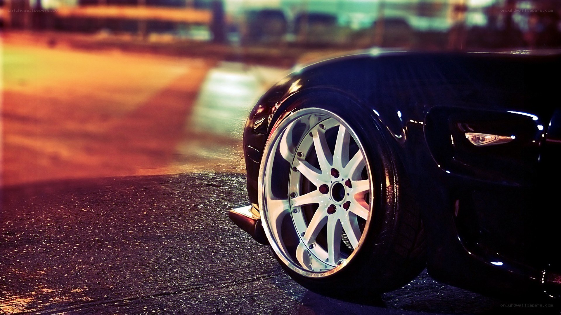black car wheel at night