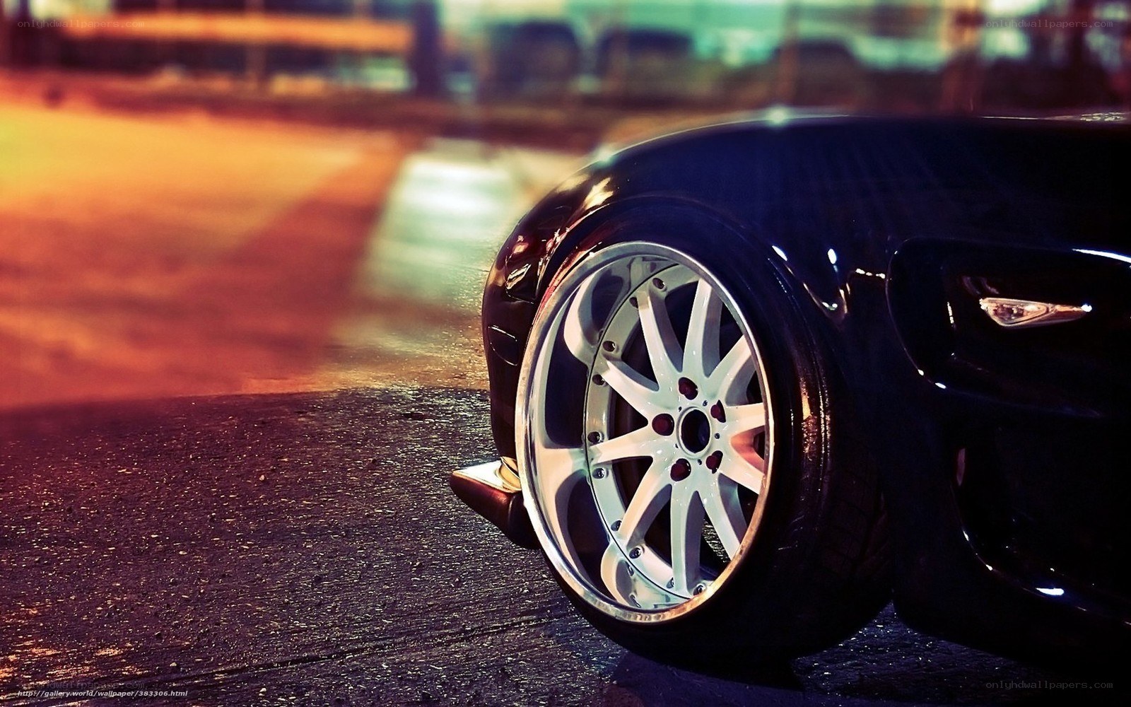 black car wheel at night