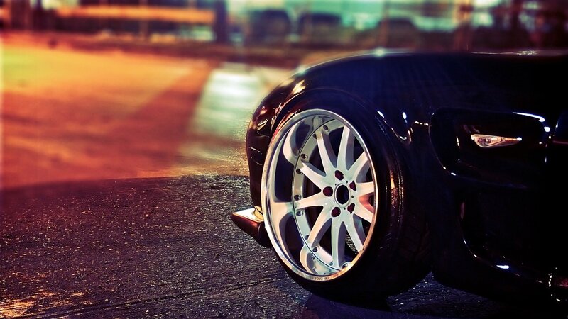 Black Car Wheel — Dramatic, Night, Photograph