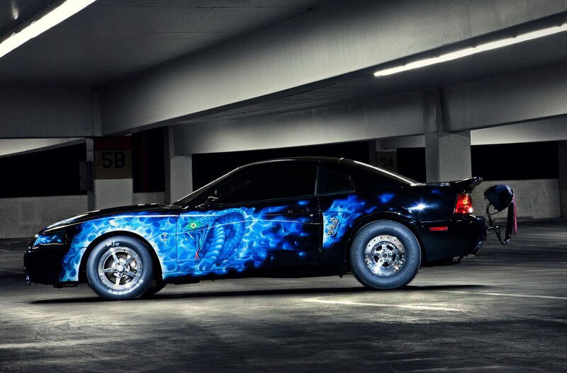 Black Car with Blue Flames — Dramatic