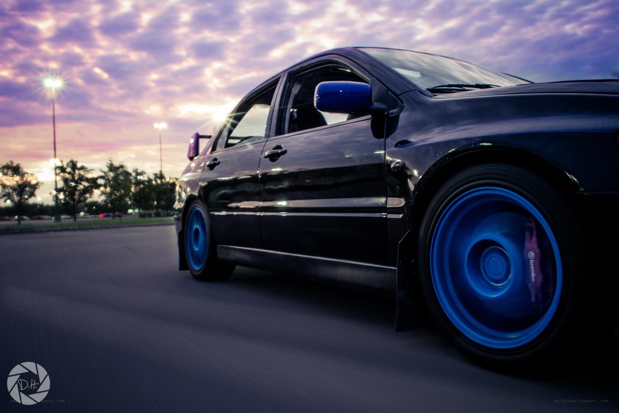 black car with blue wheels