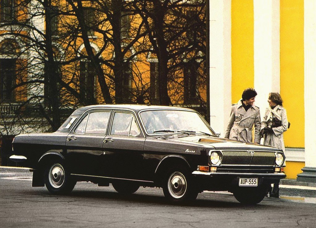 Black car with couple on street