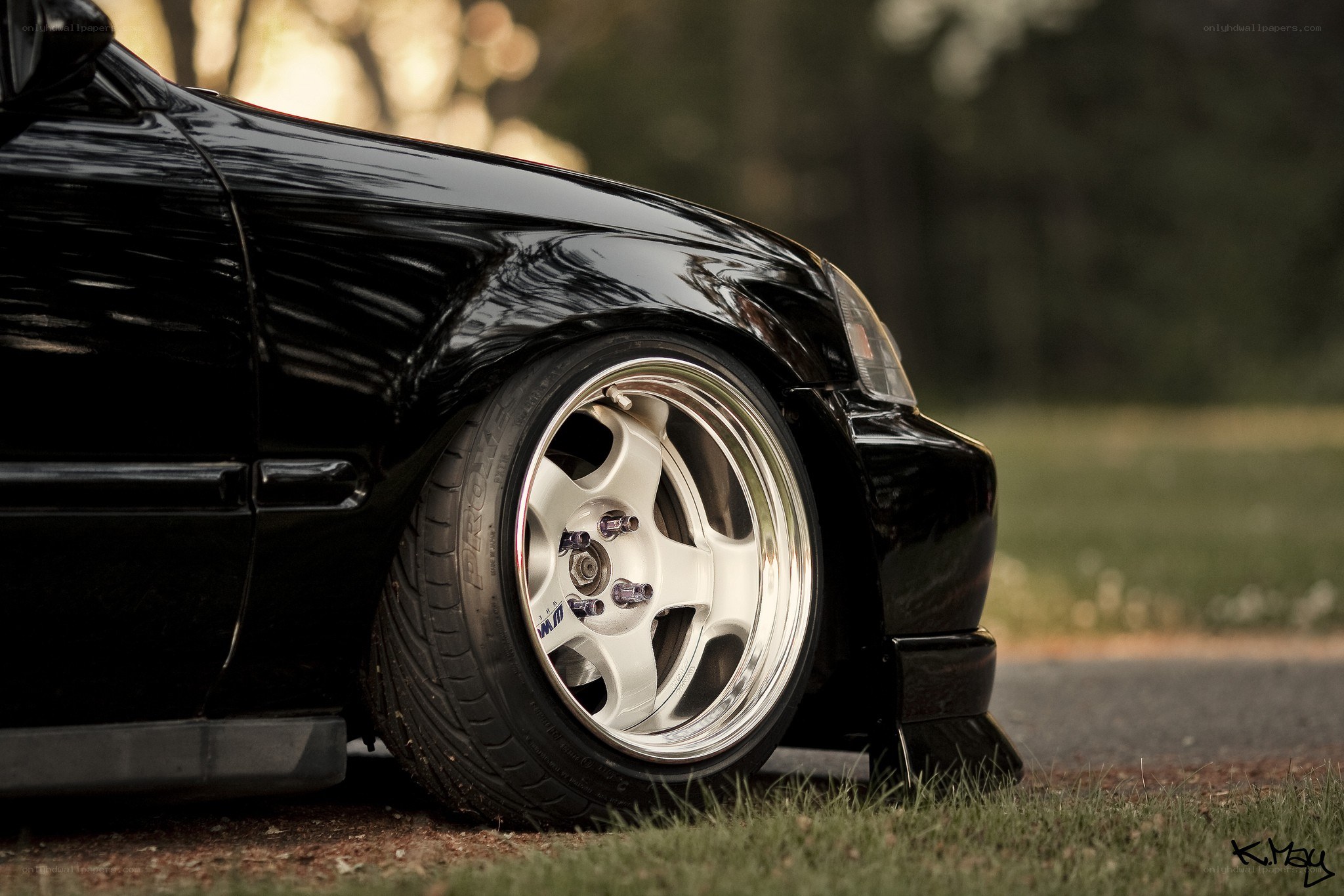black car with custom wheels